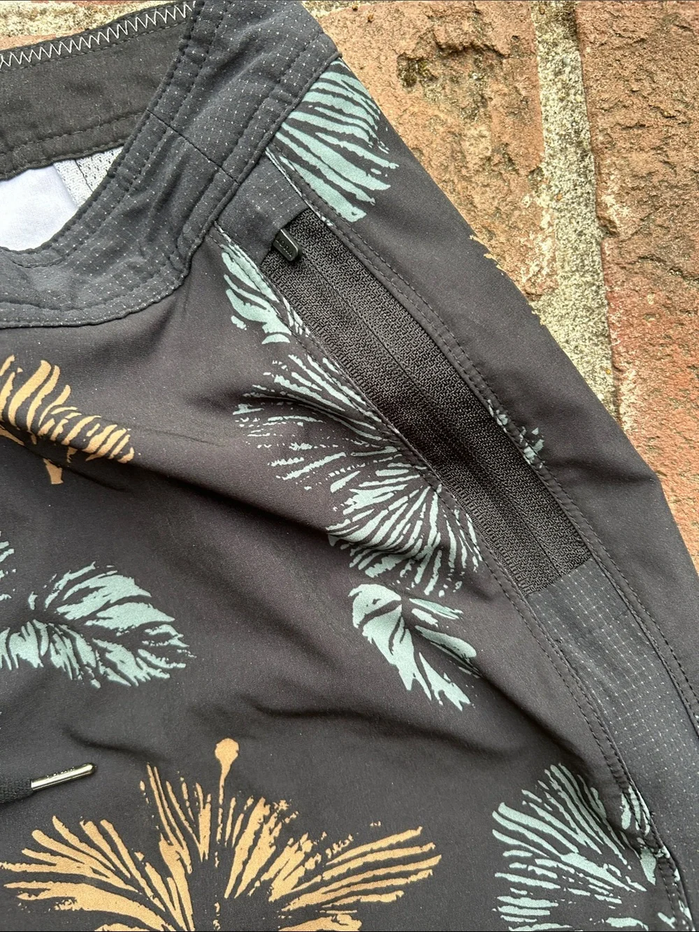 Vuori Black Swim Shorts with Teal & Tan Floral Print